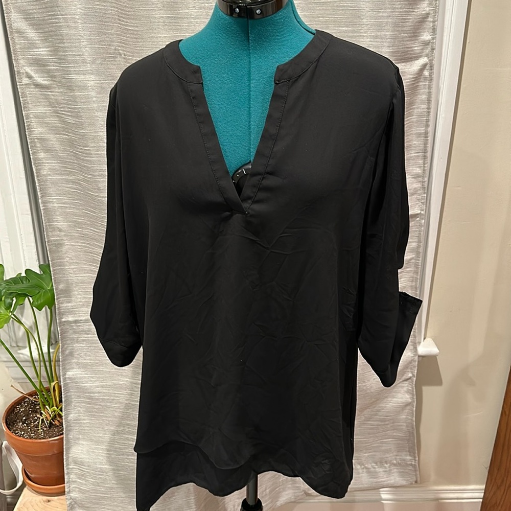 The Limited black V-neck blouse with button sleeves and asymmetrical hem. L